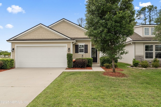 view of front facade with a garage, a front lawn, stone siding, and driveway