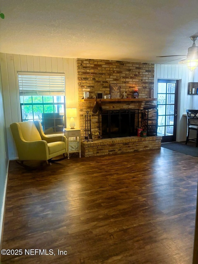 114 Timber Ln, Palatka, FL 32177 - living room with wood finished floors, a fireplace, and wood walls