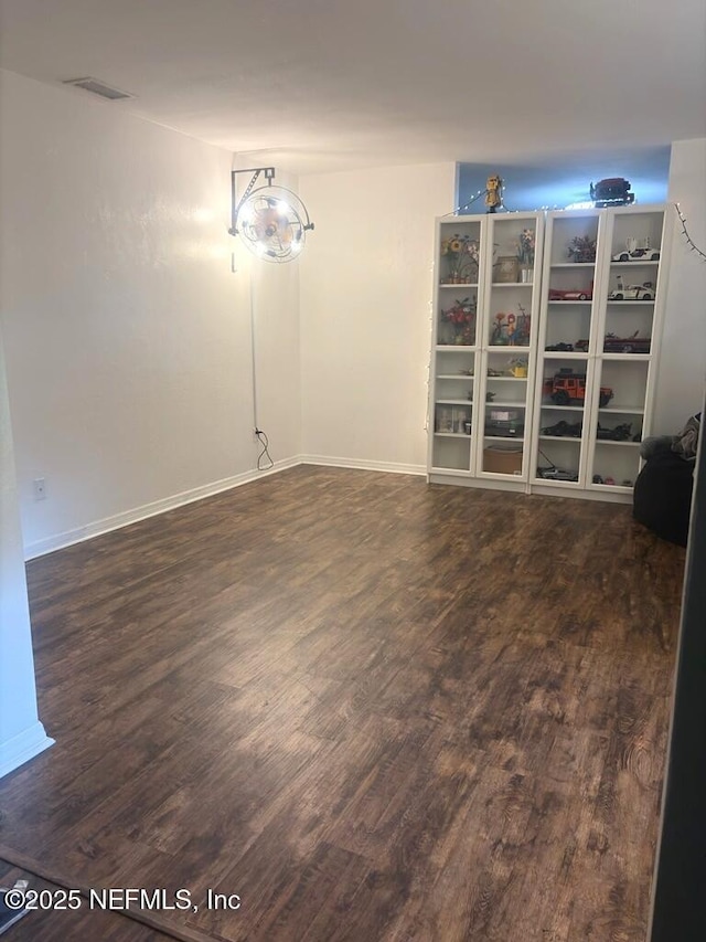 114 Timber Ln, Palatka, FL 32177 - spare room with dark wood-style flooring and baseboards