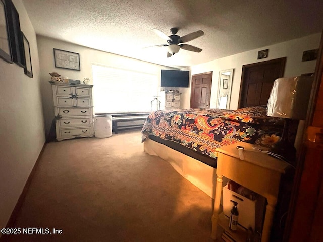 114 Timber Ln, Palatka, FL 32177 - carpeted bedroom with a textured ceiling, a ceiling fan, and two closets
