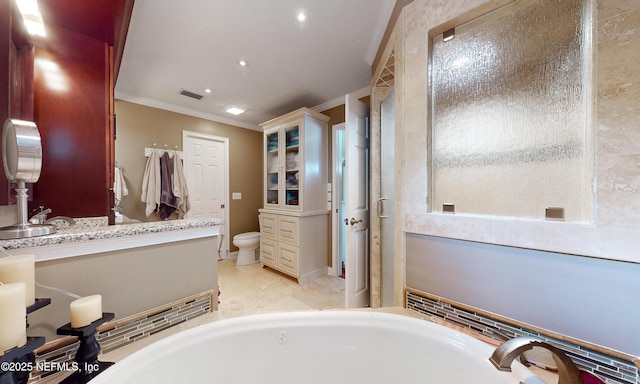 4637 Saddlehorn Trl, Middleburg, FL 32068 - full bathroom featuring a garden tub, ornamental molding, toilet, vanity, and baseboards