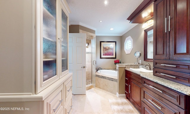4637 Saddlehorn Trl, Middleburg, FL 32068 - bathroom with a stall shower, a garden tub, a textured ceiling, vanity, and crown molding