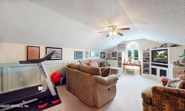 4637 Saddlehorn Trl, Middleburg, FL 32068 - living area featuring carpet flooring, a textured ceiling, lofted ceiling, a ceiling fan, and a wainscoted wall