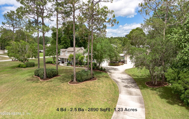 4637 Saddlehorn Trl, Middleburg, FL 32068 - view of home's community featuring driveway, a garage, and a yard