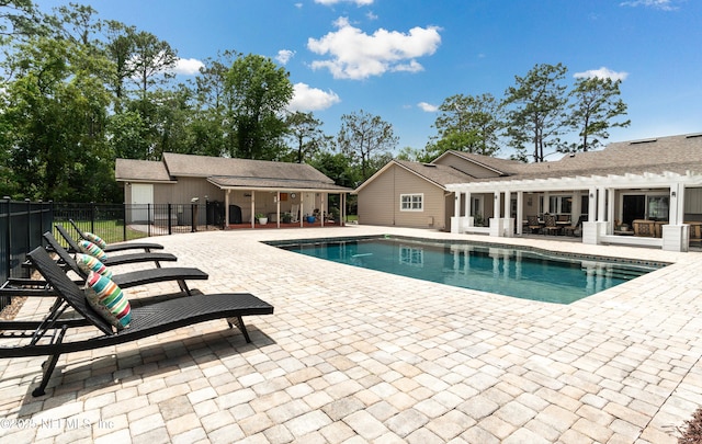 4637 Saddlehorn Trl, Middleburg, FL 32068 - view of pool featuring a pergola, a patio area, fence, and an outbuilding