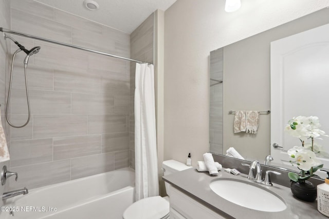 full bathroom featuring shower / tub combo, vanity, and toilet