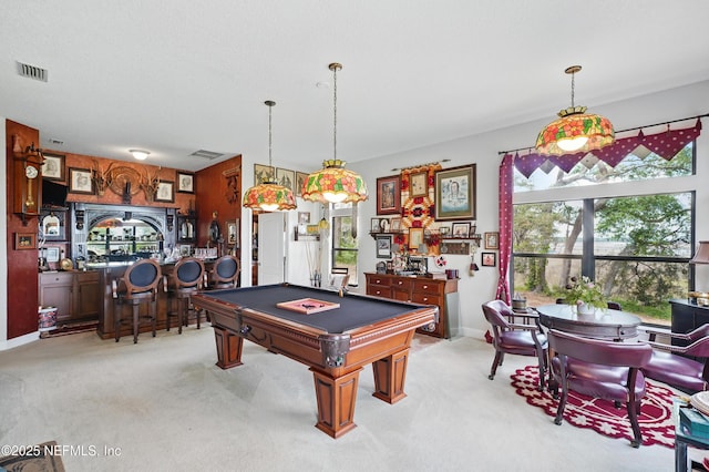 rec room with billiards, visible vents, light colored carpet, and plenty of natural light