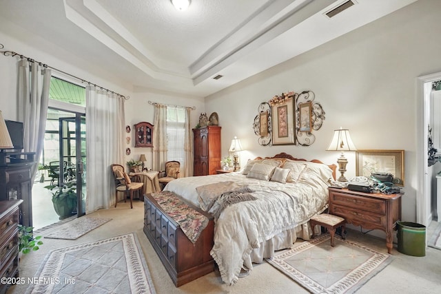 bedroom with visible vents, access to outside, multiple windows, and light colored carpet