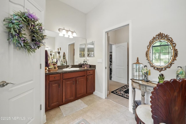 bathroom featuring tile patterned flooring and vanity