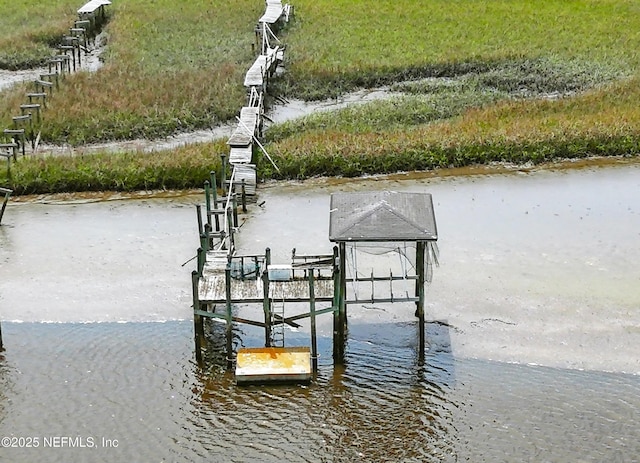 view of dock with a water view and boat lift