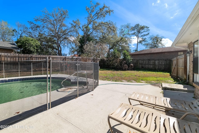 view of pool featuring a fenced backyard and a patio area