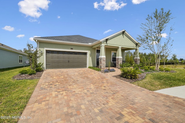 135 Neighbor Ct, Saint Augustine, FL 32092 - craftsman inspired home with a garage, fence, covered porch, a front yard, and decorative driveway