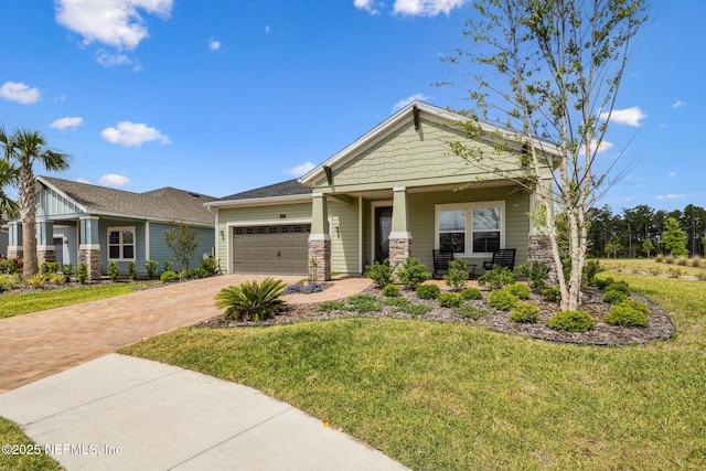 135 Neighbor Ct, Saint Augustine, FL 32092 - craftsman inspired home featuring a garage, decorative driveway, covered porch, and a front yard