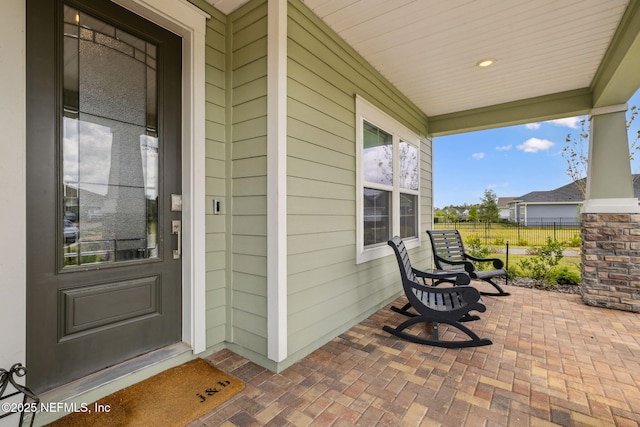 135 Neighbor Ct, Saint Augustine, FL 32092 - entrance to property with fence and covered porch