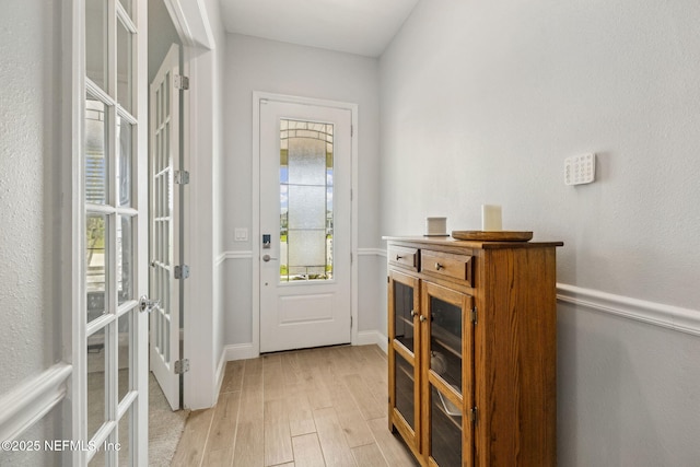 135 Neighbor Ct, Saint Augustine, FL 32092 - doorway featuring light wood-type flooring, baseboards, and french doors