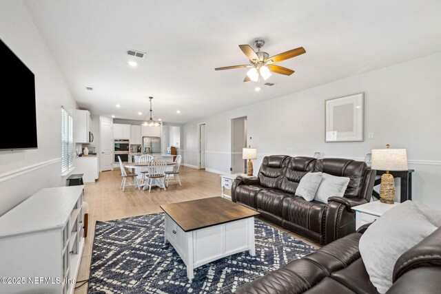 135 Neighbor Ct, Saint Augustine, FL 32092 - living room featuring recessed lighting, visible vents, ceiling fan with notable chandelier, and light wood-style floors