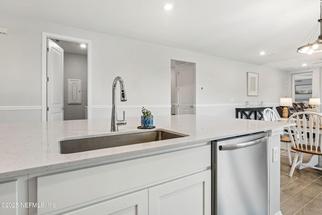 135 Neighbor Ct, Saint Augustine, FL 32092 - kitchen with decorative light fixtures, stainless steel dishwasher, a sink, recessed lighting, and white cabinetry