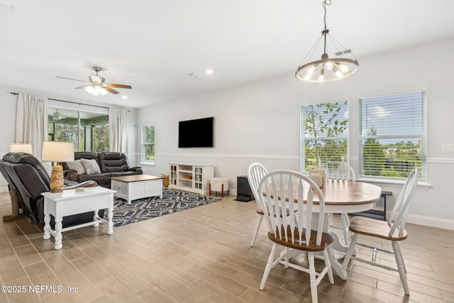 135 Neighbor Ct, Saint Augustine, FL 32092 - dining room featuring light wood-style floors, recessed lighting, and ceiling fan with notable chandelier