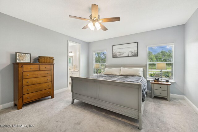 135 Neighbor Ct, Saint Augustine, FL 32092 - bedroom featuring light colored carpet, connected bathroom, baseboards, and a ceiling fan