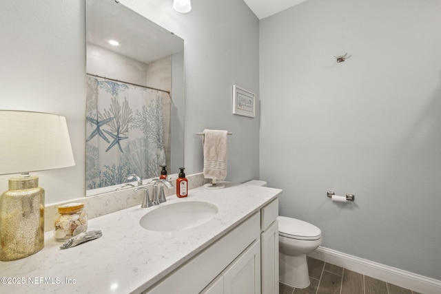 135 Neighbor Ct, Saint Augustine, FL 32092 - bathroom featuring vanity, toilet, baseboards, wood finish floors, and a shower with curtain