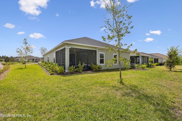 135 Neighbor Ct, Saint Augustine, FL 32092 - back of house featuring a yard and a sunroom