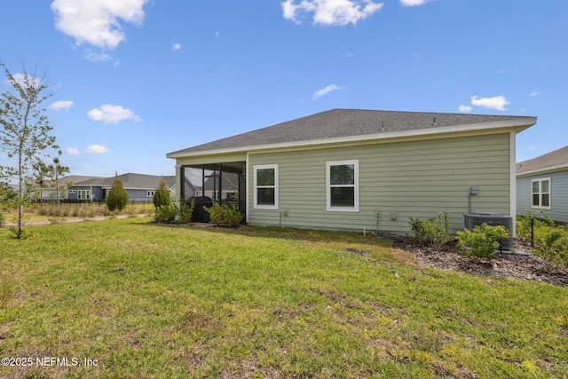 135 Neighbor Ct, Saint Augustine, FL 32092 - rear view of house featuring central air condition unit, a lawn, and a sunroom