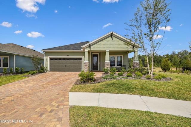 135 Neighbor Ct, Saint Augustine, FL 32092 - craftsman-style house featuring a front lawn, stone siding, a garage, a porch, and decorative driveway