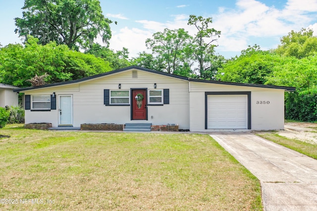 ranch-style house featuring a front lawn, driveway, an attached garage, and entry steps