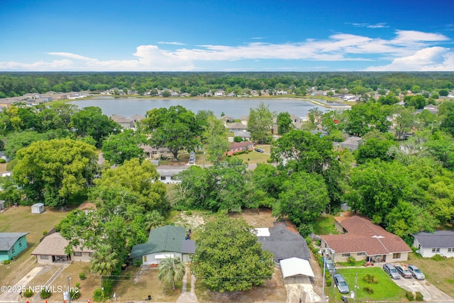 drone / aerial view with a residential view and a water view