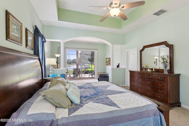 1695 Waters Edge Dr, Fleming Island, FL 32003 - bedroom featuring arched walkways, access to exterior, carpet, ornate columns, and visible vents