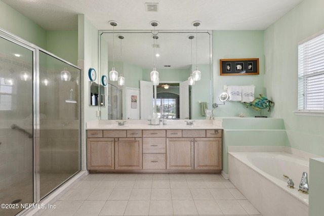1695 Waters Edge Dr, Fleming Island, FL 32003 - full bath featuring a sink, double vanity, tile patterned floors, a shower stall, and a bath