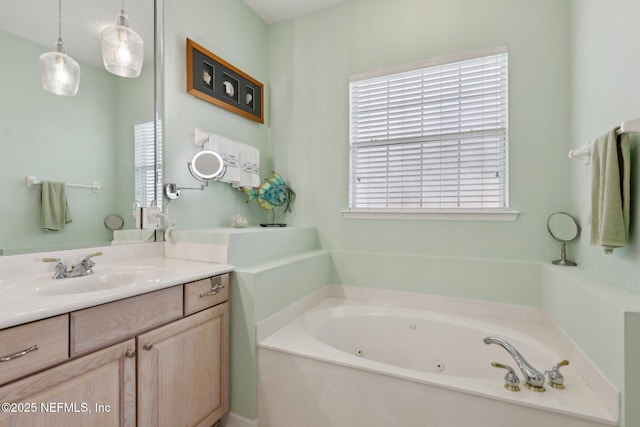 1695 Waters Edge Dr, Fleming Island, FL 32003 - bathroom with a whirlpool tub and vanity
