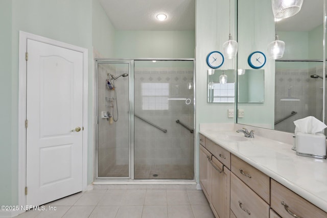1695 Waters Edge Dr, Fleming Island, FL 32003 - full bathroom with vanity, tile patterned floors, and a stall shower