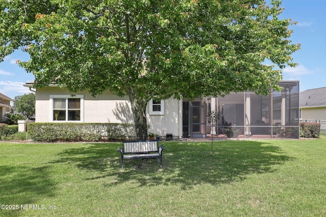 1695 Waters Edge Dr, Fleming Island, FL 32003 - rear view of house with stucco siding and a yard