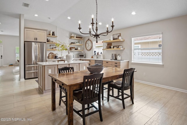 dining room featuring an inviting chandelier, recessed lighting, baseboards, vaulted ceiling, and visible vents