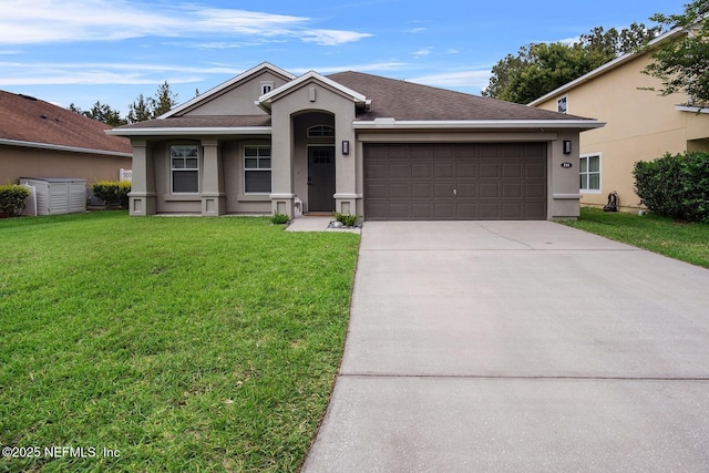 ranch-style house with an attached garage, driveway, a front lawn, and stucco siding