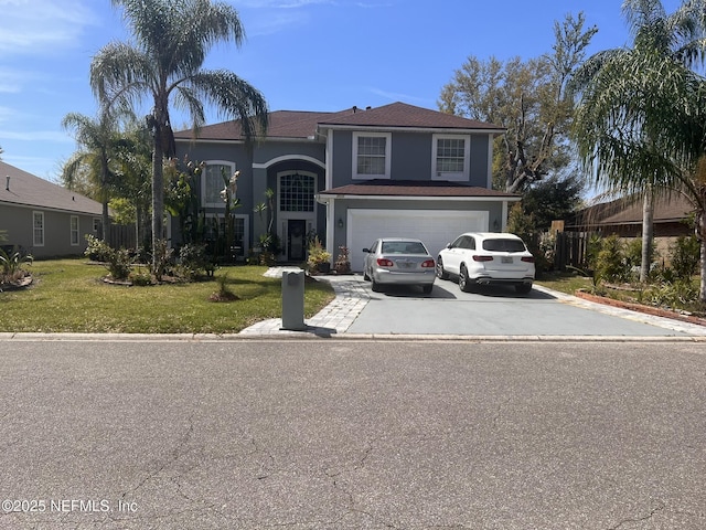 view of front of property with an attached garage, stucco siding, driveway, and a front lawn