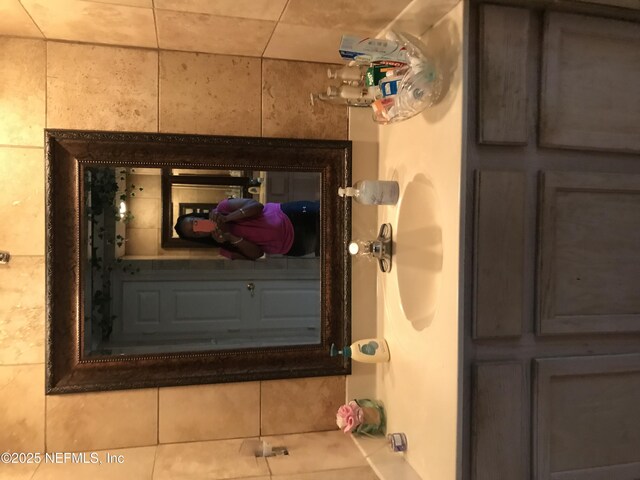 bathroom with tile patterned flooring