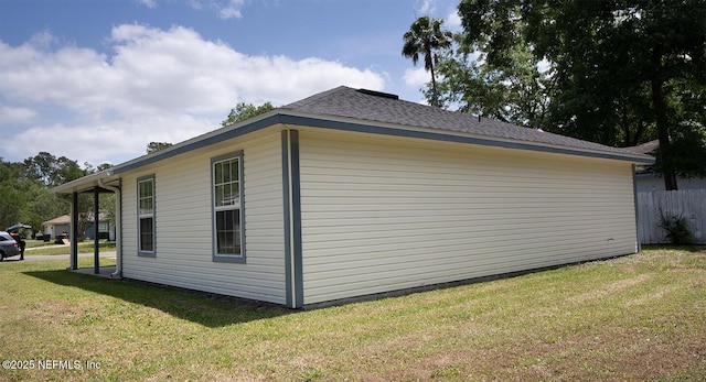 view of home's exterior with a yard