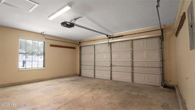 garage featuring baseboards and a garage door opener