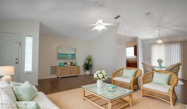 8878 Scott Woods Dr W, Jacksonville, FL 32208 - living area featuring a ceiling fan, vaulted ceiling, wood finished floors, and visible vents
