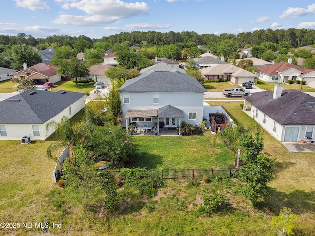 birds eye view of property with a residential view
