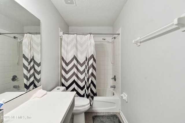 bathroom featuring wood finished floors, shower / bath combo, toilet, visible vents, and a textured ceiling