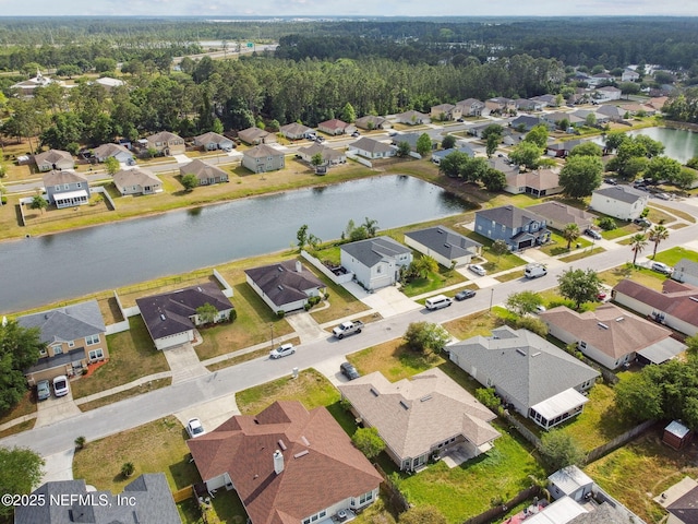 aerial view with a residential view and a water view