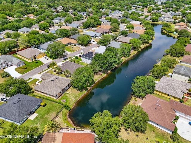 drone / aerial view with a residential view and a water view