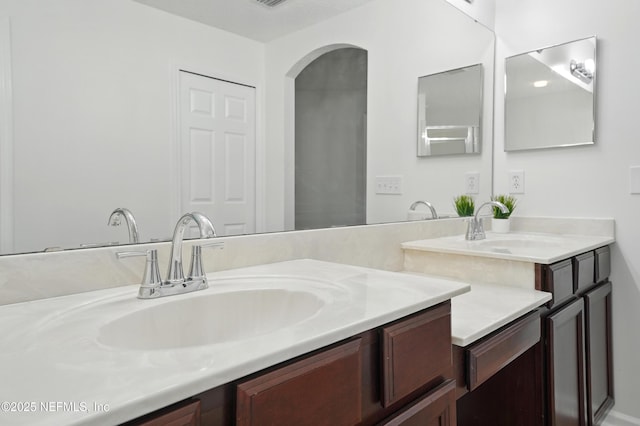 bathroom with visible vents and vanity