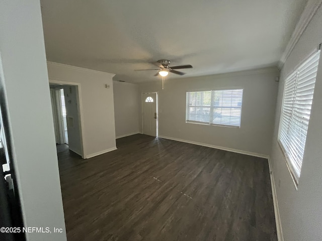 3128 Phyllis St, Jacksonville, FL 32205 - empty room featuring crown molding, dark wood-style floors, a ceiling fan, and baseboards