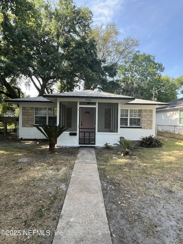 3128 Phyllis St, Jacksonville, FL 32205 - bungalow-style house featuring fence, concrete block siding, and stone siding