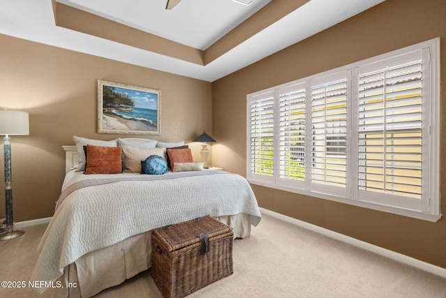 carpeted bedroom featuring baseboards
