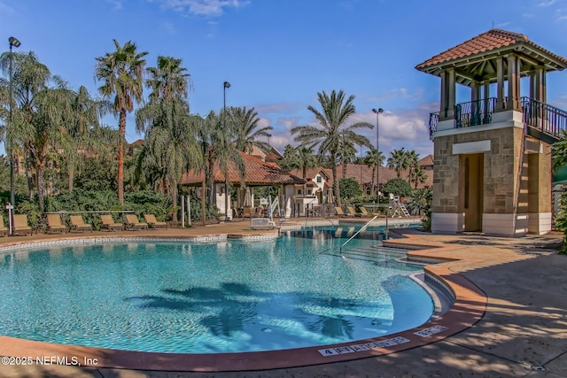 pool featuring a patio and a gazebo